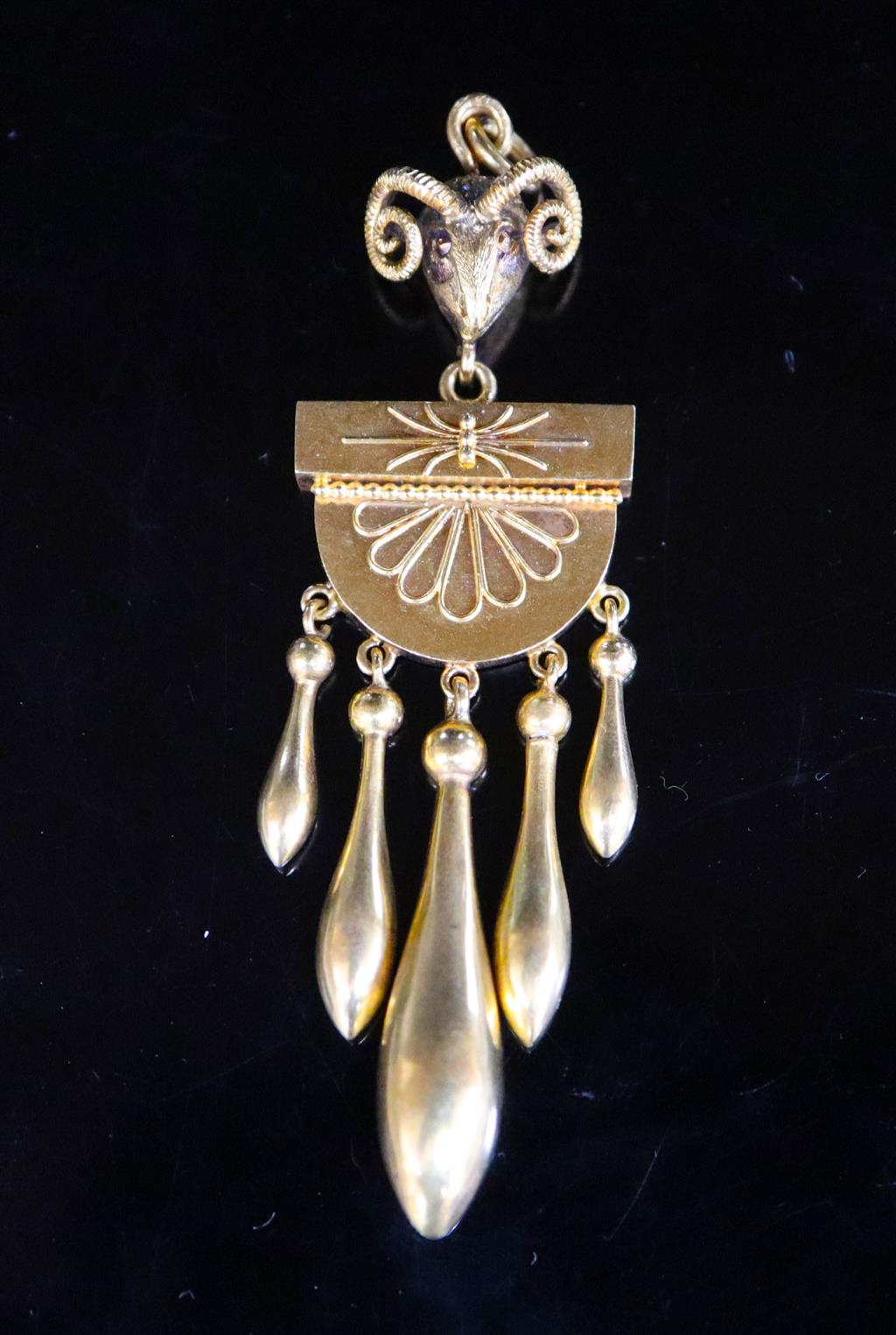 A Victorian Etruscan style gold, demi-lune and graduated five pear shaped drop pendant, with rams head bale,